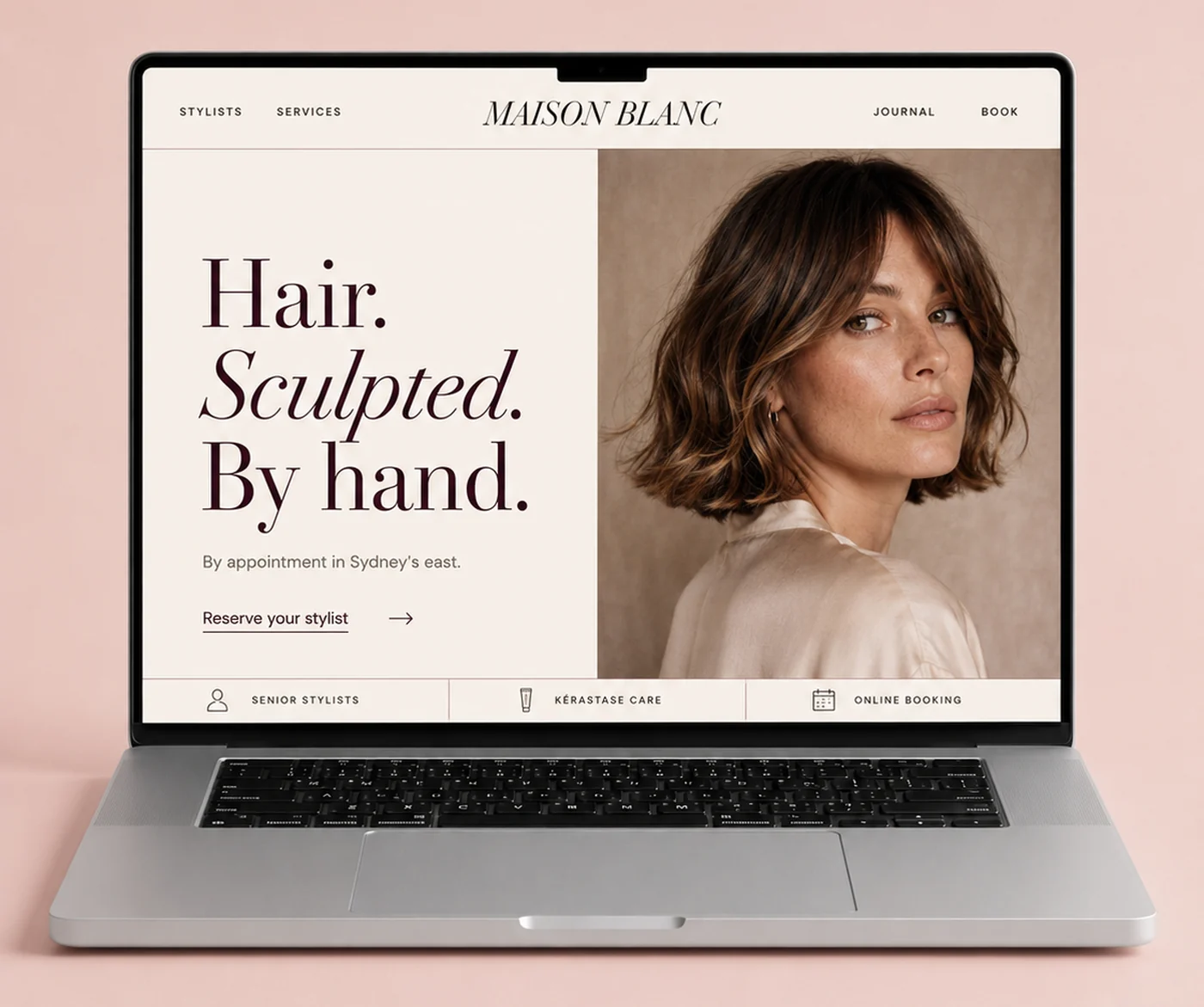 Maison Blanc salon website shown on a laptop